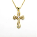 Macro detail of gold cross pendant with micro-paved zircons and a classic box chain - Hollow Pave Zirconia Cross