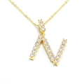 Detailed close-up of capital letter N pendant necklace with brilliant cubic zirconia - Letter N / Gold