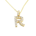Close-up of golden letter R pendant necklace with sparkling white zircon micro-pave setting - Letter R / Gold
