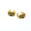 Detail of gold eye-shaped ear cuff with black zircon stones and crown detail - Crown Eye Style / Gold