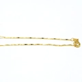 Detail shot of a delicate golden triangular prism link chain with a spring ring clasp - Style 1 (Platinum Color)