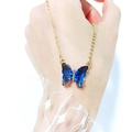 Detail of blue gradient crystal butterfly pendant with small diamonds on gold chain - Blue