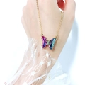 Macro shot of colorful gradient crystal butterfly pendant on a gold thin link chain - Purple AB Crystal