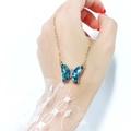 Detail of butterfly pendant necklace with blue faceted crystal and gold chain - Blue AB