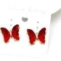 Macro detail of butterfly earrings featuring red faceted crystals and gold plating - Red (14)