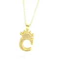 Detailed macro view of gold crown letter C pendant necklace with sparkling zircon pavé - Gold - Letter C