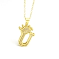 Detailed view of gold crown letter U pendant with sparkling cubic zirconia inlay - Gold - Letter U