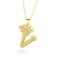 Close-up of golden crown initial V pendant with sparkling cubic zirconia pavé setting - Gold - Letter V