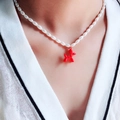 Vintage style faux pearl necklace with a vibrant red balloon dog pendant for women - Red