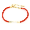 Detail view of red braided nylon bracelet with gold lobster clasp and adjustable chain - Red (Lobster Clasp)