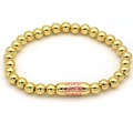 Polished 18k gold beaded bracelet featuring a capsule charm with pink engraved text - Pink