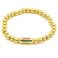 Detailed close-up of 18k gold plated beaded bracelet with colorful engraved text charm - Colorful