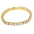 Detail van gouden tennisarmband met zirkonia stenen en stevige vouwsluiting - Goud Heldere Zirkonia Stijl