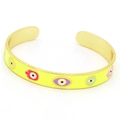Detail showing yellow enamel Hamsa hand and evil eye patterns on a gold cuff bracelet - Yellow