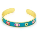 Macro detail of the golden Hamsa hand and blue evil eye charms on the enamel bangle - Blue