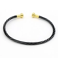Dettaglio del bracciale in corda intrecciata nera e argento con terminali sferici dorati - Torsione Nero e Argento (12#)