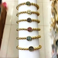 Detailed set of six beaded bracelets with colorful zircon smiley face charms on gold beads - Gold Bead Smiley Green (D1)