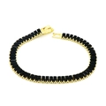 Detailed view of gold tennis bracelet featuring rectangular black cubic zirconia stones - Black Bracelet