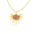 Detailed close-up of golden sunray pendant with ruby-colored and clear zircon stones - Radiant Sun Ray Style (218) / Gold with Red Rhinestones