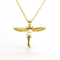Detailed shot of gold dragonfly pendant with colorful zircon wings and a white center pearl - Dragonfly Style (C1)