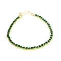Detailed macro view of gold heart-shaped green zircon tennis chain with lobster clasp closure - Necklace / Green