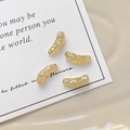 Detail view of 18k gold plated hammered texture curved tube beads for DIY jewelry making - 18K Gold