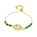 Detail of adjustable golden evil eye bracelet with blue pupil and green zircon stones - Teardrop Blue Eye Green Stone Style (A3)