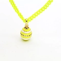 Close-up of a neon yellow egg pendant necklace with white stripes and cubic zirconia stones - Neon Yellow Striped Style (02)