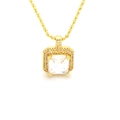 Macro shot of gold rope chain necklace with emerald-cut crystal and zircon cluster pendant - White