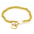 Golden beaded bracelet featuring baroque pearl and square 'Fe' letter pendant on white background - Iron
