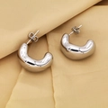 Macro detail of polished silver chunky C-shaped earrings on elegant silk background - Silver Polished Dimensional C-Shape Style / Silver