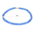 Detail of blue cat eye stone bead necklace with a 36cm length and golden magnetic clasp - Sky Blue