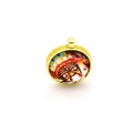 Detailed macro view of the golden metal pendant featuring a traditional ethnic pattern border - Colorful Ethnic Art (B1)