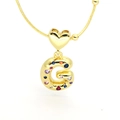 Macro detail of puffy letter G pendant with colorful cubic zirconia in 18k gold plating - Letter G Style