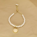 Detail of beaded pearl bracelet with gold adjustable slide clasp and letter N pendant - Letter N