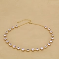 Elegant gold necklace with rectangular emerald green and round clear cubic zirconia stones - White