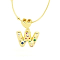 Macro shot of letter W pendant with colorful zircons and heart clasp on gold chain - Letter W Style