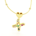 Detailed macro view of gold letter X pendant with colorful cubic zirconia and heart bail - Letter X Style