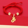 Handmade red cord bracelet with a golden zodiac snake charm and decorative gold beads - Hollow Bead Zodiac Snake (E) / Red & Gold