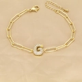 Detailed shot of 18k gold paperclip chain bracelet with zircon pavé letter G pendant - Letter G