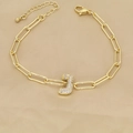Detail of 18k gold paperclip chain bracelet featuring a zircon pavé letter J charm - Letter I