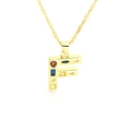 Macro detail of gold letter F pendant with colorful zircon stones on a rope chain necklace - Letter F