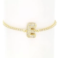 Macro view of gold-plated letter E pendant with crystal pavé on tennis bracelet chain - Letter E