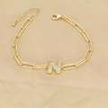Detailed view of an 18k gold-plated paperclip chain bracelet with a cubic zirconia N pendant - Letter N