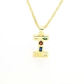 Detail of gold-plated letter I pendant featuring multi-colored cubic zirconia stones - Letter I