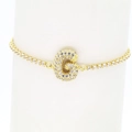 Detailed close-up of 18k gold tennis bracelet featuring a micro-paved zircon letter G - Letter G