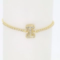 Detailed close-up of 18k gold plated tennis bracelet with sparkling zircon letter I pendant - Letter I