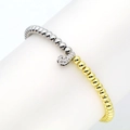 Detail of two-tone beaded elastic bracelet with sparkling crystal letter J charm - Letter J