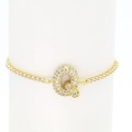 Close-up of gold plated tennis bracelet with sparkling zircon letter Q pendant charm - Letter Q