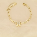 Detailed view of gold paperclip chain bracelet with a zircon-encrusted letter X pendant - Letter X